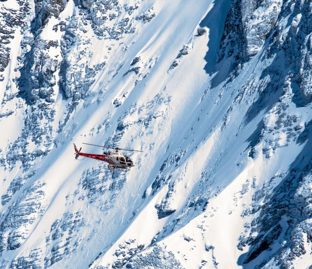 Helicopter heliskiing steep alpine terrain, Northern British Columbia
